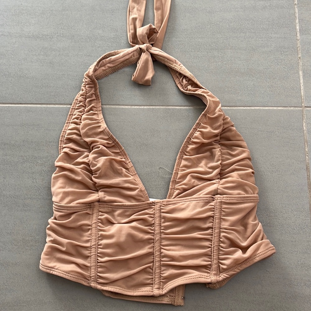 Halter runched crop top. NEVER WORN.Tag still on. Adjustable back and top sizing